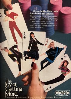 an advertisement for playing cards with women's clothes on them and the words, the joy of getting more