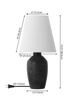 a large black vase with a white lamp on it's side and measurements for the base