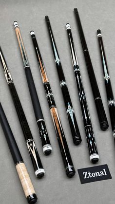 seven different types of pens and their packaging on a table top with the name zitonal written in black ink