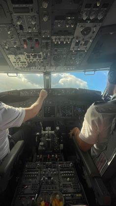 two pilots in the cockpit of an airplane