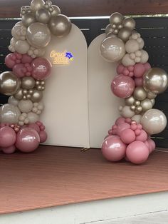 an arch made out of balloons on top of a table