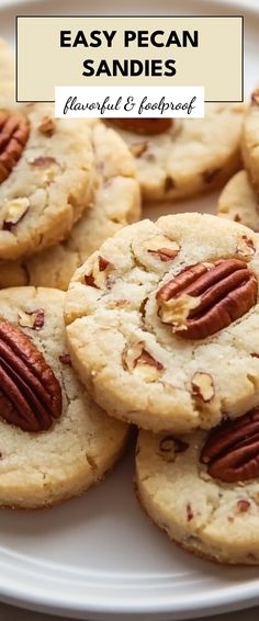 several pecan cookies on a white plate with the words easy pecan sandies