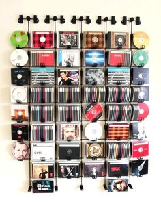 there is a wall that has many cds on it