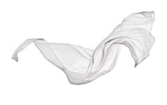a white cloth flying through the air on top of a white surface with no one in it