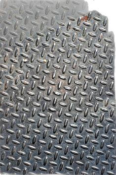 a metal grate with holes in the middle
