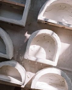 some white shelves are on the side of a building