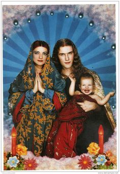 an image of three women and a baby in front of a blue background with flowers