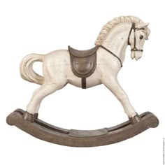 a white horse figurine on a wooden stand