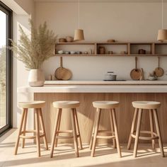 three stools are in front of the counter