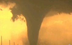 a very large tornado is coming out of the sky