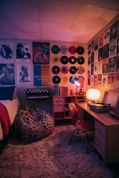 a bedroom with various records on the wall