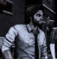 a man in a tie standing next to another person