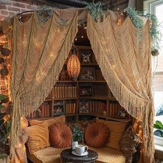 a living room filled with lots of furniture next to a book shelf covered in lights