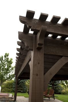 a large wooden structure sitting in the middle of a park