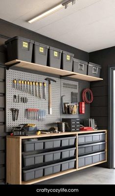 a garage with lots of tools hanging on the wall and storage bins above it