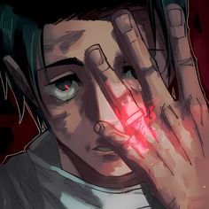 a man holding his hands to his face with red light coming out of the eyes