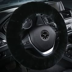 the steering wheel cover is black in color