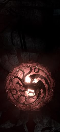 a lit candle in the shape of a dragon