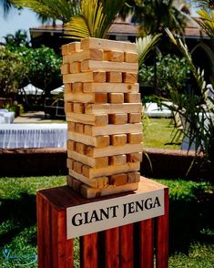 a giant stack of wood blocks sitting on top of a wooden box