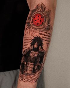 a man with a tattoo on his arm has a ladybug and black hair