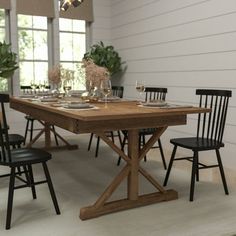 a dining table with four chairs around it