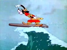 an animated mickey mouse surfing in the ocean