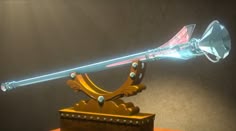 a glass and metal object on top of a wooden table with light coming from it