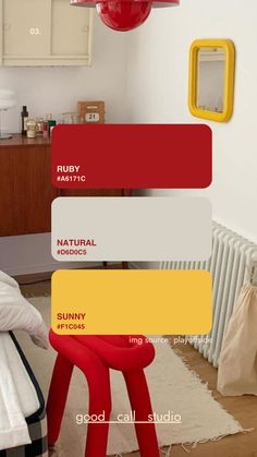 a bedroom with red, yellow and white paint colors on the walls next to a bed