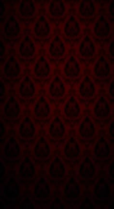 a dark red background with an intricate pattern