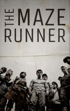 a group of people standing next to each other in front of a sign that says the maze runner