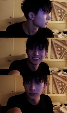 two young men are smiling and posing for the camera in front of some wallpaper