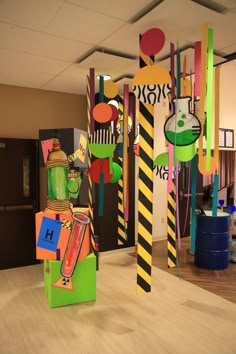 an office decorated with paper mache art and decorating the walls, floors, and ceiling