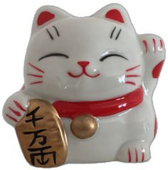 a white cat figurine with chinese writing on it's chest and eyes closed