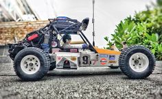 an off road vehicle is parked on the street