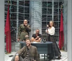 the actors are posing for a photo on stage