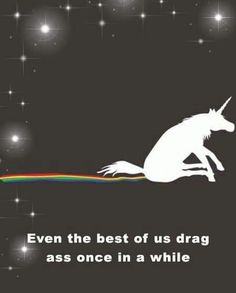a white unicorn sitting on top of a black ground with stars in the sky behind it