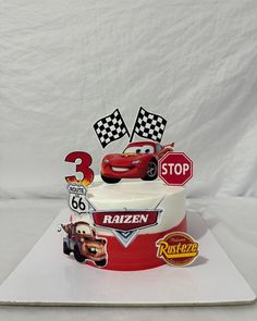 a birthday cake with cars on it