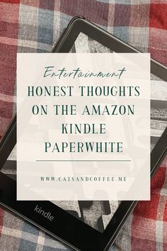 the amazon kindle paperwhite is sitting on top of a plaid blanket