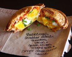 an egg omelet is cut in half on a piece of paper