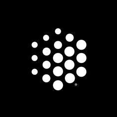 a black background with white circles in the center and one circle at the bottom that is surrounded by smaller dots