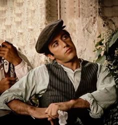 two men are sitting next to each other