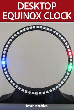 an image of a clock with lights in the shape of a circle on top of it