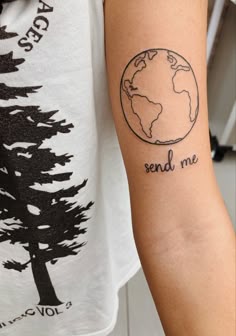 a person with a small tattoo on their arm that says send me to the earth