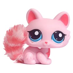 a pink toy with big blue eyes and a furry tail on it's back