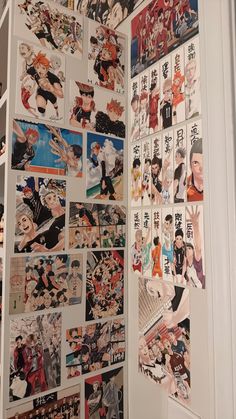 a wall covered in pictures and stickers next to a doorway with an open door