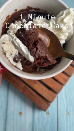 a bowl filled with chocolate cake and ice cream on top of a wooden cutting board