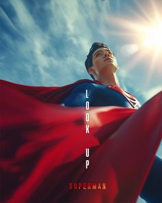 a man in a superman costume looking up into the sky