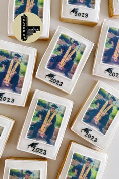 some cookies with pictures on them sitting next to each other