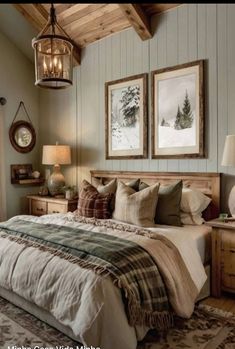 a bedroom with a bed, lamps and pictures on the wall