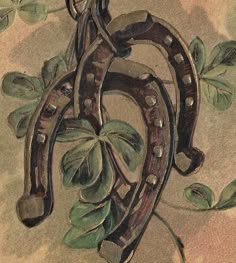an image of a happy new year card with horseshoes and leaves on the front